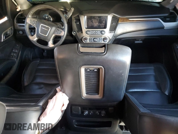 2018 GMC Yukon Denali with VIN 1GKS1CKJ0JR106589, listed as a Copart auction lot 79977034 with 98,022 mi miles and Salvage Title. Bid and sale history available at carsss.com. Image 8.