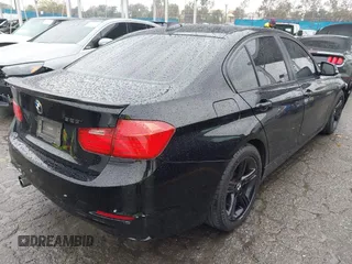 2015 BMW 3 Series 328i with VIN WBA3A5C59FF606236, listed as a IAAI auction lot 41690502 with 115,085 mi miles. Bid and sale history available at carsss.com. Image 4.