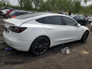 2019 Tesla Model 3 Mid Range z VIN 5YJ3E1EA2KF486532, wystawiony jako Copart lot #58082635 z przebiegiem 51 920 mil mil oraz Tytuł czysty. Historia ofert i sprzedaży dostępna na DreamBid. Obrazek 3.