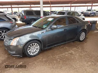 2011 Cadillac CTS Luxury with VIN 1G6DF5EY6B0104932, listed as a IAAI auction lot 42032457 with 165,833 mi miles and . Bid and sale history available at DreamBid. Image 2.