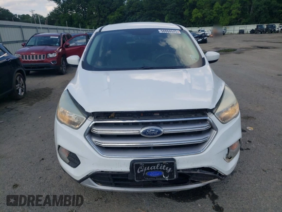 2017 Ford Escape SE z VIN 1FMCU0GD8HUA54074, wystawiony jako Copart lot #58860525 z przebiegiem 149 668 mil mil oraz Szkoda całkowita • Salvage title. Historia ofert i sprzedaży dostępna na DreamBid. Obrazek 5.