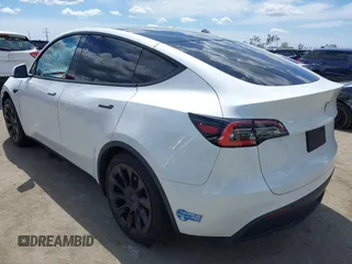 2020 Tesla Model Y Long Range with VIN 5YJYGDEE2LF058515, listed as a IAAI auction lot 41932748 with 62,885 mi miles and . Bid and sale history available at DreamBid. Image 3.