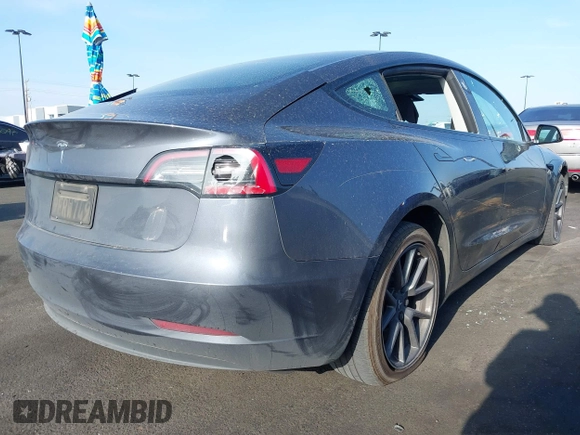 2023 Tesla Model 3 with VIN 5YJ3E1EA4PF427022, listed as a IAAI auction lot 42465964 with 169,346 mi miles and . Bid and sale history available at DreamBid. Image 4.
