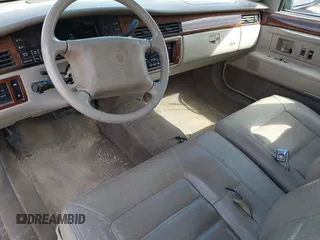 1995 Cadillac Concours z VIN 1G6KF52YXSU302434, wystawiony jako IAAI lot #42231281 z przebiegiem 153 236 mil mil oraz . Historia ofert i sprzedaży dostępna na DreamBid. Obrazek 12.
