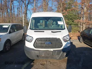 2019 Ford Transit with VIN 1FTYE1CM6KKA74930, listed as a IAAI auction lot 41020843 with 104,218 mi miles and . Bid and sale history available at DreamBid. Image 12.