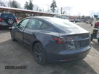 2023 Tesla Model 3 with VIN 5YJ3E1EA2PF623217, listed as a IAAI auction lot 41701413 with 21,246 mi miles and . Bid and sale history available at DreamBid. Image 3.
