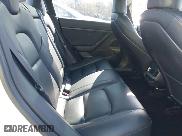 2020 Tesla Model 3 Standard Range Plus with VIN 5YJ3E1EA7LF797150, listed as a IAAI auction lot 41869088 with 75,708 mi miles and . Bid and sale history available at carsss.com. Image 8.