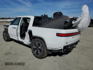 2024 Rivian R1T Adventure z VIN 7FCTGCAA9RN030318, wystawiony jako Copart lot #77036474 z przebiegiem 3 522 mil mil oraz Szkoda całkowita • Salvage title. Historia ofert i sprzedaży dostępna na DreamBid. Obrazek 2.