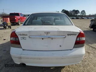 2001 Daewoo Nubira z VIN KLAJC52Z01K711120, wystawiony jako Copart lot #48926575 z przebiegiem 103 375 mil mil oraz Tytuł czysty. Historia ofert i sprzedaży dostępna na DreamBid. Obrazek 6.