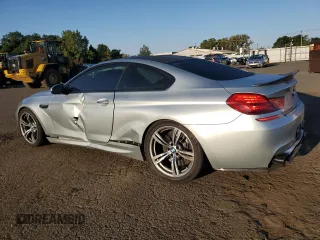 2013 BMW M6 z VIN WBSLX9C58DD159800, wystawiony jako Copart lot #68904984 z przebiegiem 107 426 mil mil oraz Szkoda całkowita • Salvage title. Historia ofert i sprzedaży dostępna na DreamBid. Obrazek 2.