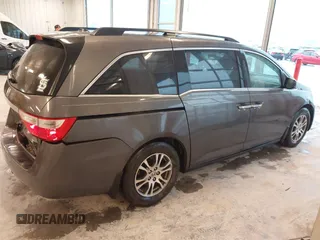 2012 Honda Odyssey EX-L with VIN 5FNRL5H66CB127507, listed as a IAAI auction lot 41961465 with 228,972 mi miles and . Bid and sale history available at carsss.com. Image 13.