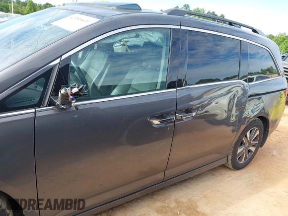 2015 Honda Odyssey Touring Elite z VIN 5FNRL5H97FB060981, wystawiony jako IAAI lot #42289631 z przebiegiem 160 947 mil mil oraz . Historia ofert i sprzedaży dostępna na DreamBid. Obrazek 14.