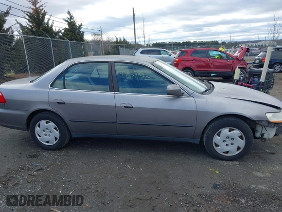 2000 Honda Accord LX z VIN 1HGCG1649YA096212, wystawiony jako IAAI lot #41737193 z przebiegiem 181 489 mil mil oraz . Historia ofert i sprzedaży dostępna na DreamBid. Obrazek 13.
