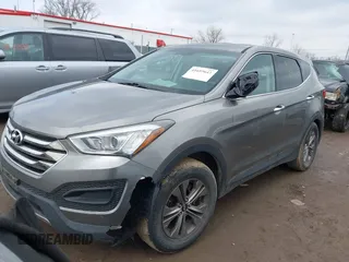 2016 Hyundai Santa Fe z VIN 5XYZTDLB1GG343763, wystawiony jako IAAI lot #41659641 z przebiegiem 96 415 mil mil oraz . Historia ofert i sprzedaży dostępna na DreamBid. Obrazek 2.
