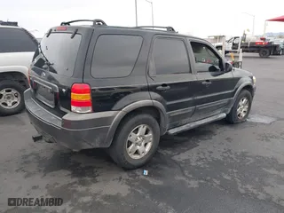 2006 Ford Escape XLT with VIN 1FMYU03156KA42961, listed as a IAAI auction lot 41820423 with 168,212 mi miles. Bid and sale history available at carsss.com. Image 4.