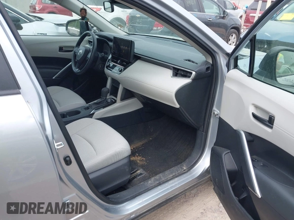 2023 Toyota Corolla Cross L with VIN 7MUAAABG9PV047493, listed as a IAAI auction lot 42441413 with 15,485 mi miles and . Bid and sale history available at DreamBid. Image 5.