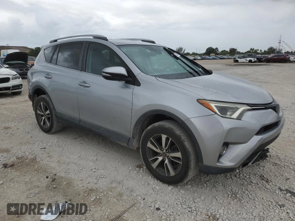 2018 Toyota RAV4 XLE with VIN 2T3WFREV4JW444884, listed as a Copart auction lot 55666275 with 174,275 mi miles and Salvage Title. Bid and sale history available at DreamBid. Image 4.