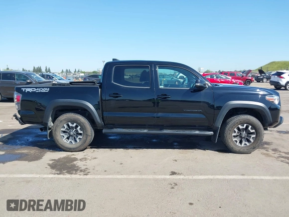 2021 Toyota Tacoma SR z VIN 3TMCZ5AN3MM421868, wystawiony jako IAAI lot #42003665 z przebiegiem 39 380 mil mil oraz . Historia ofert i sprzedaży dostępna na DreamBid. Obrazek 13.