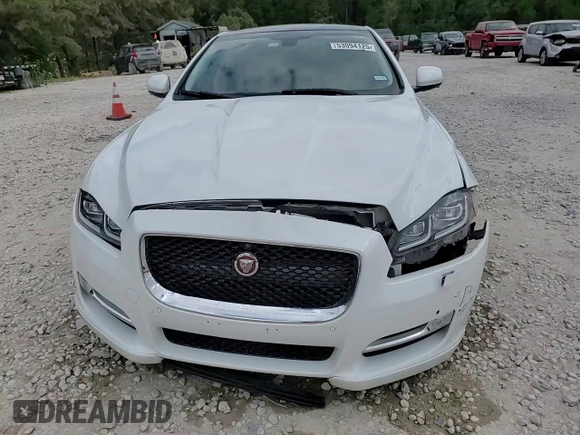 2016 Jaguar XJ R-Sport z VIN SAJWA1C71G8V92642, wystawiony jako Copart lot #53094125 z przebiegiem 98 548 mil mil oraz Szkoda całkowita • Salvage title. Historia ofert i sprzedaży dostępna na DreamBid. Obrazek 13.