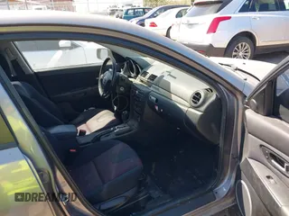 2006 Mazda 3 s Grand Touring with VIN JM1BK323261410457, listed as a IAAI auction lot 42057678 with 203,872 mi miles. Bid and sale history available at carsss.com. Image 5.