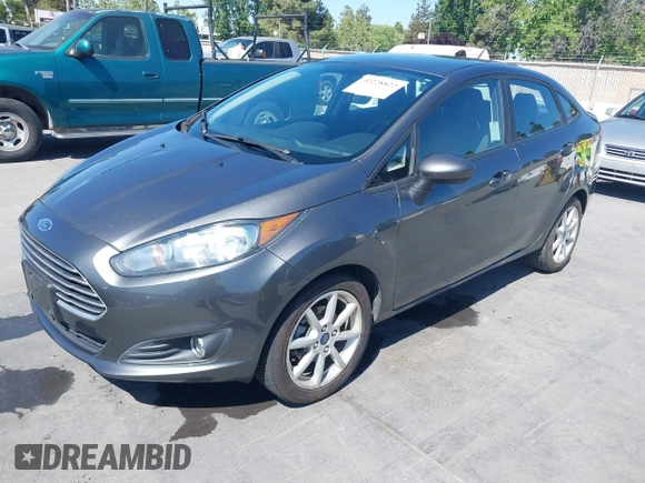 2019 Ford Fiesta SE z VIN 3FADP4BJ2KM131012, wystawiony jako IAAI lot #42228822 z przebiegiem 100 460 mil mil oraz . Historia ofert i sprzedaży dostępna na DreamBid. Obrazek 2.