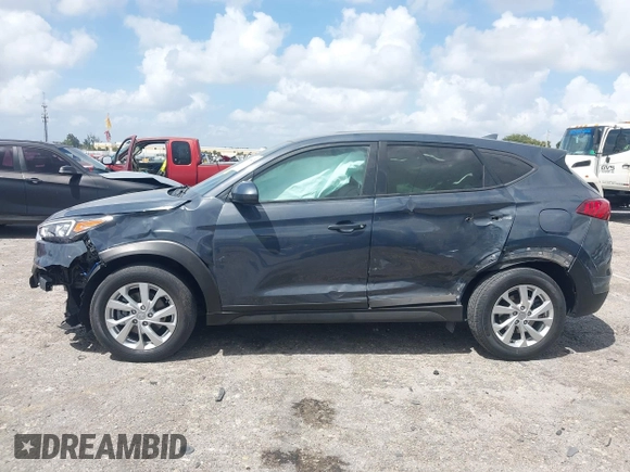2021 Hyundai Tucson SE with VIN KM8J23A41MU291085, listed as a IAAI auction lot 41956974 with 93,932 mi miles. Bid and sale history available at carsss.com. Image 14.