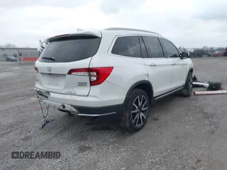 2020 Honda Pilot Touring 8-Passenger with VIN 5FNYF6H96LB056229, listed as a IAAI auction lot 41738249 with 65,099 mi miles and . Bid and sale history available at DreamBid. Image 4.