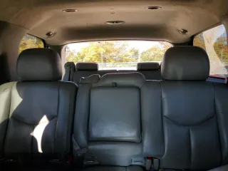 2004 GMC Yukon SLE with VIN 1GKEK13V24J236327, listed as a Copart auction lot 76896974 with 151,028 mi miles and Salvage Title. Bid and sale history available at carsss.com. Image 10.