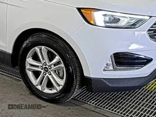 2019 Ford Edge SEL with VIN 2FMPK3J9XKBC37759, listed as a IAAI auction lot 42666643 with 103,812 mi miles and . Bid and sale history available at DreamBid. Image 1.
