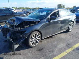 2021 Mazda 3 Premium with VIN JM1BPADL7M1303484, listed as a IAAI auction lot 41666785 with 34,476 mi miles and . Bid and sale history available at DreamBid. Image 2.
