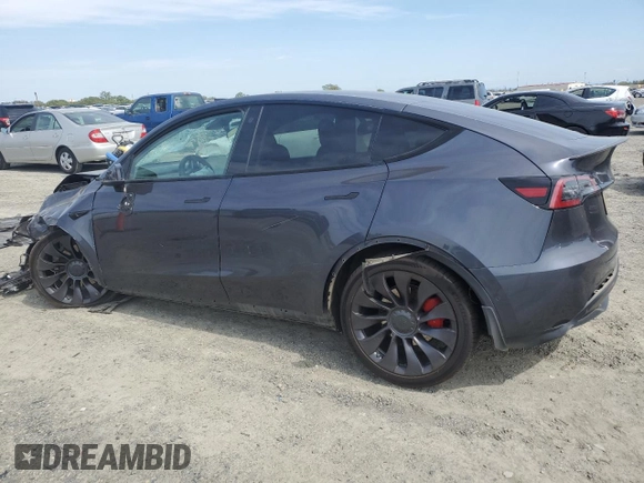 2021 Tesla Model Y Performance with VIN 5YJYGDEF2MF262273, listed as a Copart auction lot 50569245 with 90,879 mi miles and Salvage Title. Bid and sale history available at DreamBid. Image 2.