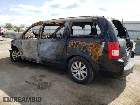 2010 Chrysler Town & Country Touring Plus with VIN 2A4RR8DX8AR361044, listed as a Copart auction lot 48940705 with Not Provided miles and Salvage Title. Bid and sale history available at DreamBid. Image 2.