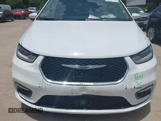2023 Chrysler Pacifica Hybrid Touring L with VIN 2C4RC1L71PR622474, listed as a IAAI auction lot 42595061 with 55,880 mi miles and . Bid and sale history available at DreamBid. Image 6.