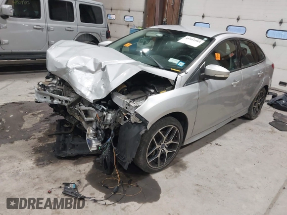 2015 Ford Focus SE with VIN 1FADP3F24FL272863, listed as a IAAI auction lot 41561084 with 103,875 mi miles. Bid and sale history available at carsss.com. Image 2.