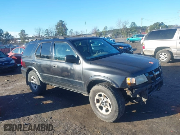 2003 Isuzu Rodeo with VIN 4S2CK58W034303195, listed as a IAAI auction lot 41219379 with 215,821 mi miles and . Bid and sale history available at DreamBid. Image 1.