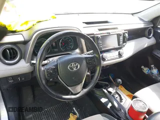 2016 Toyota RAV4 Hybrid XLE with VIN JTMRJREVXGD029019, listed as a IAAI auction lot 42021530 with 74,400 mi miles. Bid and sale history available at carsss.com. Image 20.