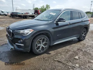 2018 BMW X1 xDrive28i with VIN WBXHT3C39J5K26188, listed as a Copart auction lot 61647905 with 93,392 mi miles and Salvage title. Bid and sale history available at DreamBid. Image 1.