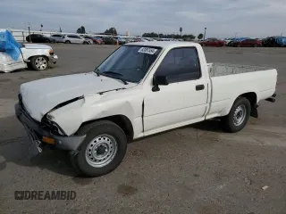 1989 Toyota Pickup DX с VIN JT4RN81P9K5043258, выставлен на аукционе Copart как лот 82087554 с пробегом 164 081 миль миль и Списание • Salvage title. История ставок и продаж доступна на DreamBid. Изображение 1.