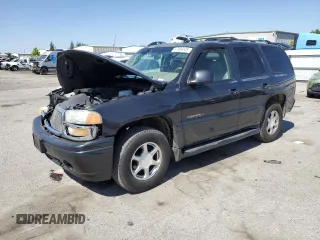 2003 GMC Yukon Denali z VIN 1GKEK63U63J253618, wystawiony jako Copart lot #57869325 z przebiegiem 147 253 mil mil oraz Szkoda całkowita • Salvage title. Historia ofert i sprzedaży dostępna na DreamBid. Obrazek 1.