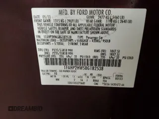 2011 Ford Taurus SEL z VIN 1FAHP2HW5BG182538, wystawiony jako Copart lot #55148545 z przebiegiem 181 815 mil mil oraz Nie do naprawy • Non repairable. Historia ofert i sprzedaży dostępna na DreamBid. Obrazek 13.