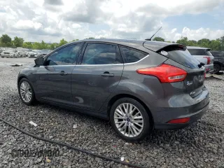 2015 Ford Focus Titanium z VIN 1FADP3N28FL239706, wystawiony jako Copart lot #62478895 z przebiegiem 143 536 mil mil oraz Szkoda całkowita • Salvage title. Historia ofert i sprzedaży dostępna na DreamBid. Obrazek 2.