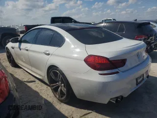 2016 BMW M6 z VIN WBS6E9C55GGF92676, wystawiony jako Copart lot #77663924 z przebiegiem 36 548 mil mil oraz Szkoda całkowita • Salvage title. Historia ofert i sprzedaży dostępna na DreamBid. Obrazek 2.