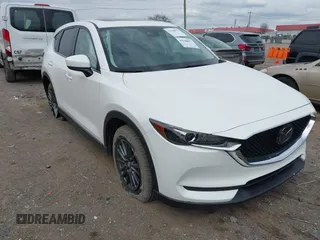 2021 Mazda CX-5 Touring z VIN JM3KFBCM2M1395663, wystawiony jako IAAI lot #41948073 z przebiegiem 47 029 mil mil oraz . Historia ofert i sprzedaży dostępna na DreamBid. Obrazek 17.