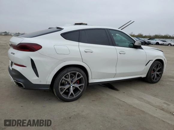 2021 BMW X6 M50i with VIN 5UXCY8C04M9D98395, listed as a Copart auction lot 85536134 with 57,891 mi miles and Salvage Title. Bid and sale history available at carsss.com. Image 3.