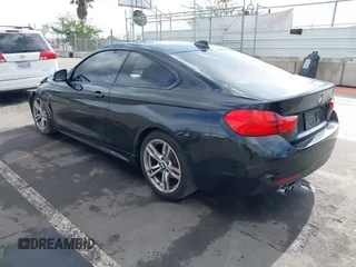 2014 BMW 4 Series 428i with VIN WBA3N7C55EF719504, listed as a IAAI auction lot 41403957 with 98,882 mi miles and . Bid and sale history available at carsss.com. Image 3.