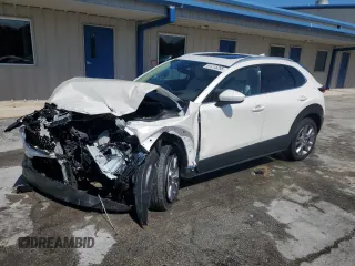 2021 Mazda CX-30 Premium with VIN 3MVDMADL6MM264079, listed as a Copart auction lot 61215285 with 7,387 mi miles and Salvage title. Bid and sale history available at DreamBid. Image 1.