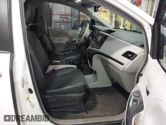 2014 Toyota Sienna SE with VIN 5TDXK3DC7ES497390, listed as a IAAI auction lot 42037096 with 169,127 mi miles and . Bid and sale history available at DreamBid. Image 5.