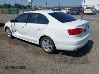 2014 Volkswagen Jetta TDI w/Premium/Nav with VIN 3VWLL7AJXEM366828, listed as a IAAI auction lot 42392563 with 132,924 mi miles and . Bid and sale history available at DreamBid. Image 3.