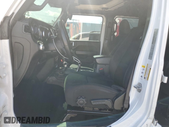 2019 Jeep Wrangler Unlimited Sport Altitude with VIN 1C4HJXDG2KW675235, listed as a Copart auction lot 54389785 with 88,825 mi miles and Salvage title. Bid and sale history available at DreamBid. Image 7.