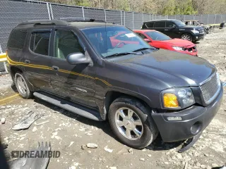2004 GMC Envoy SLT with VIN 1GKET16S046155005, listed as a Copart auction lot 53554505 with 184,039 mi miles and Salvage Title. Bid and sale history available at DreamBid. Image 4.